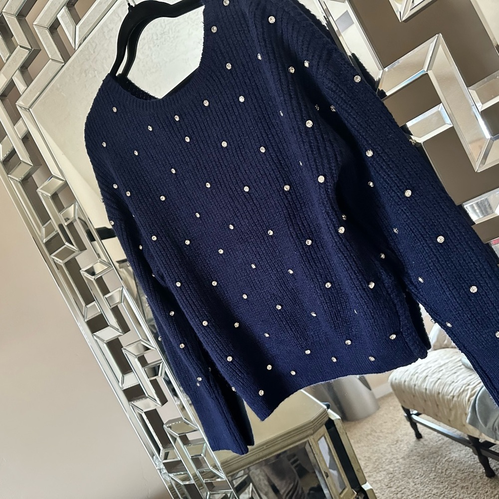 Small blue sweater with Cristal all over with a twisted back , new with out tags